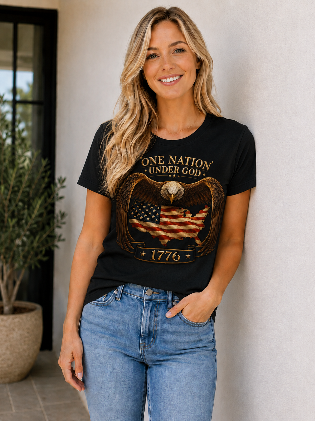 Unity 1776 patriotic graphic t-shirt featuring a bald eagle with spread wings over an American flag shaped United States design.